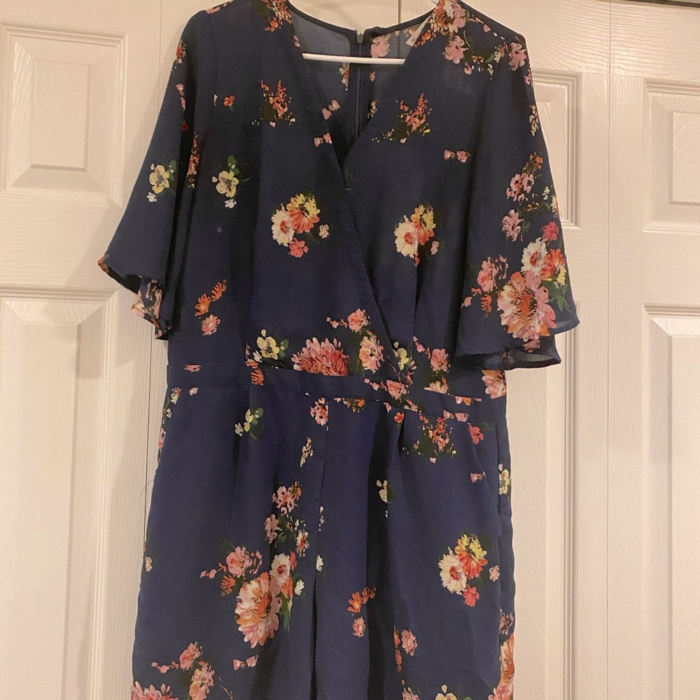 Lila Rose Romper with pockets slightly sheer.